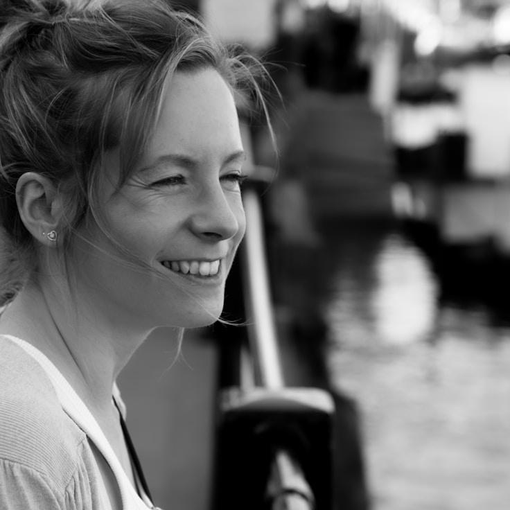 C. Reed Johnson, Lead Design Curator at RiverStoneGlade, reviewing corporate floral arrangements